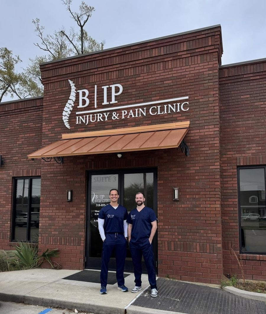 Harold J. Bayonne Jr., MD, and Max Keeling, DO, standing outside Bayonne Injury & Pain Clinic
